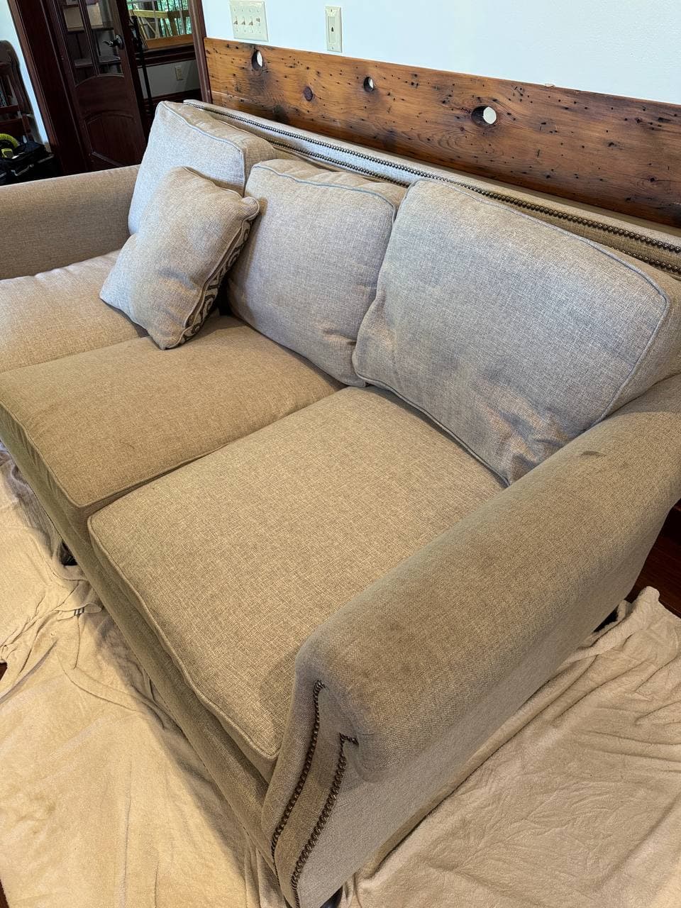 Sofa prepared for a PureLoom upholstery cleaning appointment
