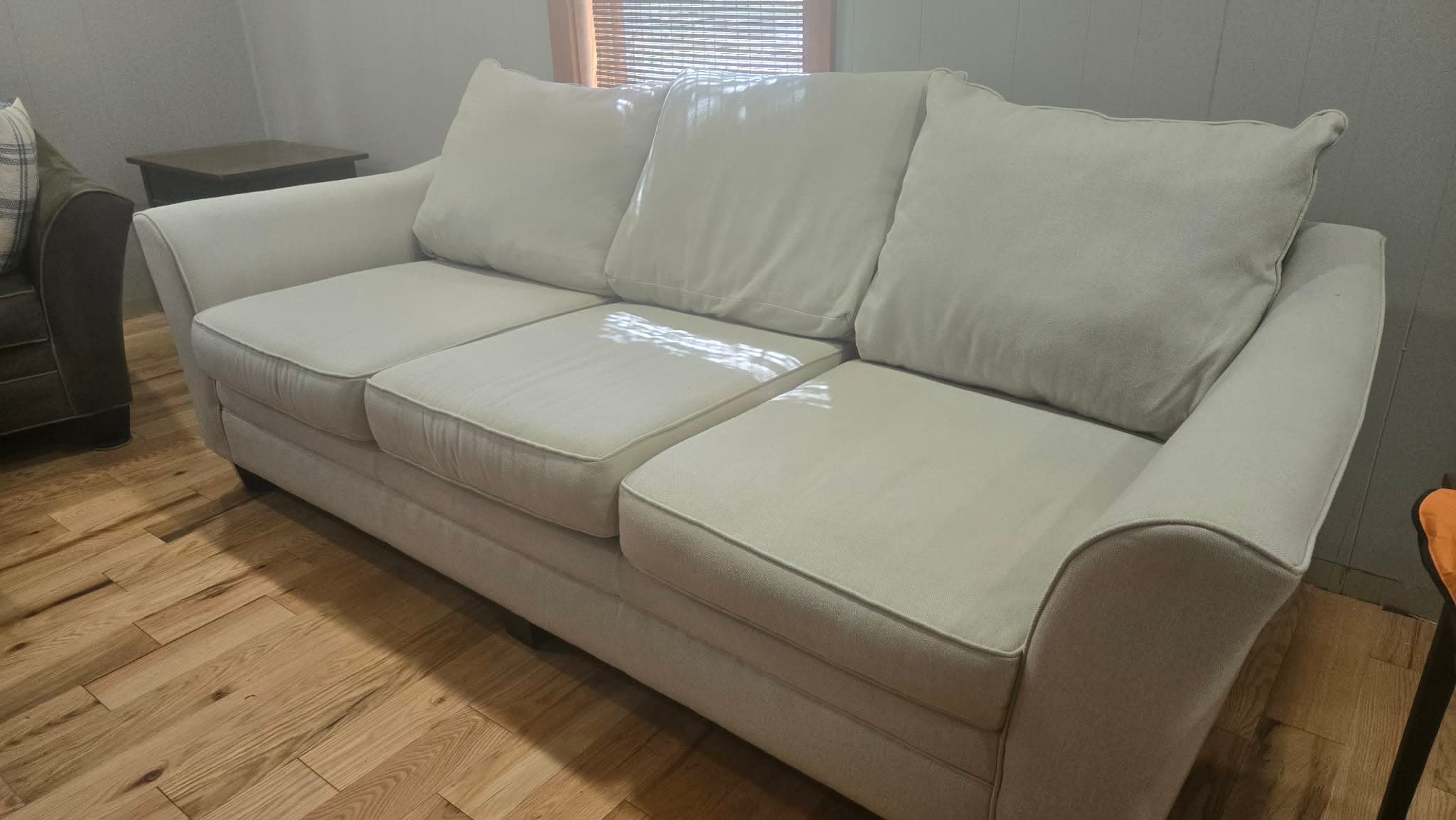Freshly cleaned cream sofa in a Rochester, NY home