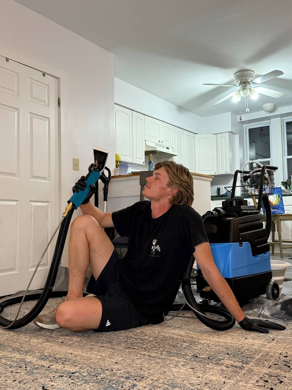 Orest performing upholstery extraction cleaning on site
